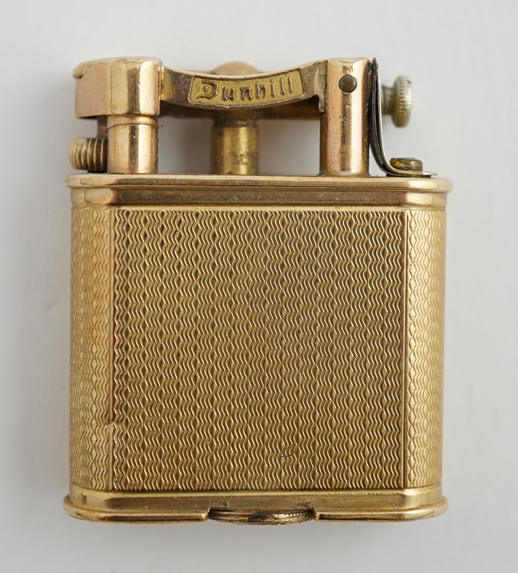 A George V engine turned 9ct gold cased Dunhill lighter